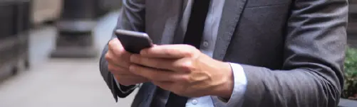 man communicating with tenant on cell phone
