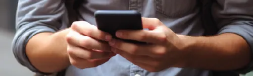 man texting on cell phone